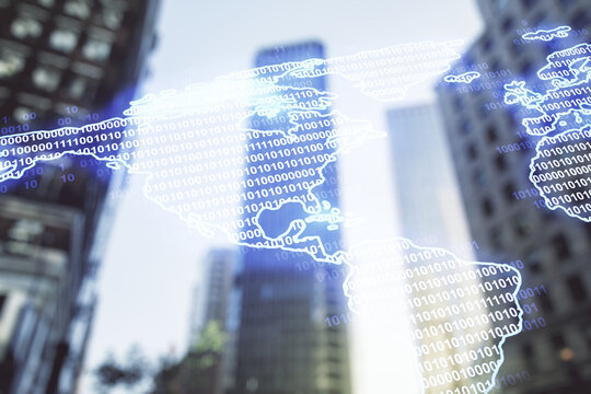 Double exposure of graphic America map hologram on blurry cityscape background, big data and digital technology concept