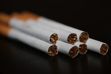 A view from a number of cigarettes isolated on black background tobacco close up quit smoking cessation cigaret bad habit nicotine junkie big size high quality instant print
