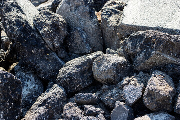 close up of a pile of dug up used tarmac 