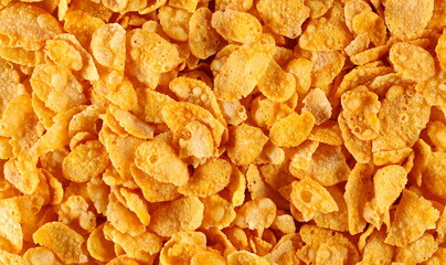 Crunchy corn flakes, cereal, muesli pile background and texture, top view