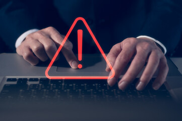 internet network security concept, man typing on keyboard with triangle warning sign developer with...
