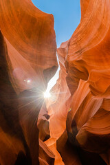 Abstract sandstone underground canyon cave with strong light and orange, red and purple color.
