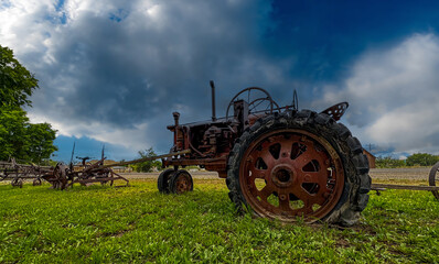 Rusty vintage tractor in the countryside