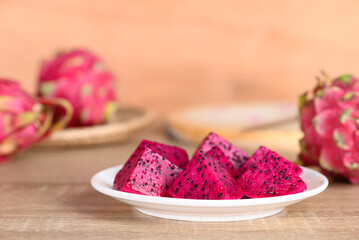 Obraz na płótnie Canvas Sliced red dragon fruit or pitaya ready to eating, Tropical fruit in summer season