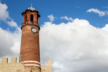 Fototapeta premium Clock Tower of Erzurum Castle with Traditional Red Tiled Architecture.copy space