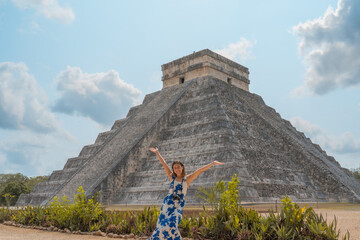 young woman visits one of the most beautiful pyramids in the world, the pyramid of chichen itza in...