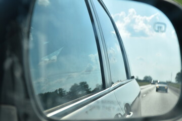 Naklejka premium Reflection in a Side Mirror