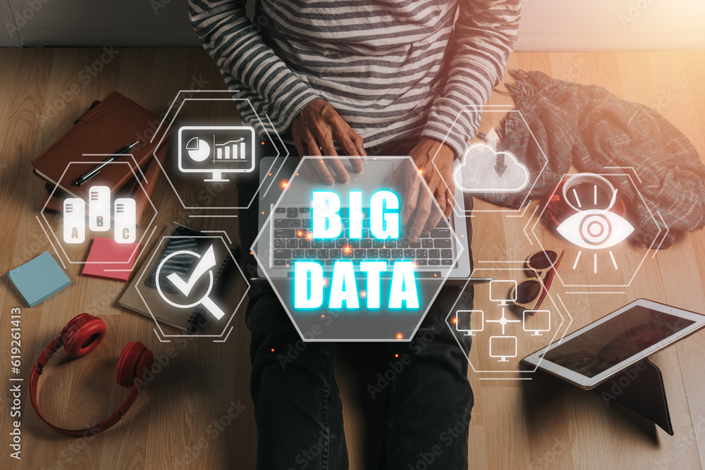 Poster big data concept, person using laptop and smartphone with big data icon on vr screen on office desk.