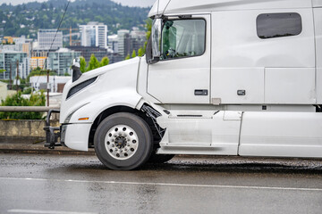 Broken after an accidental collision big rig semi truck tractor standing out of service on the...