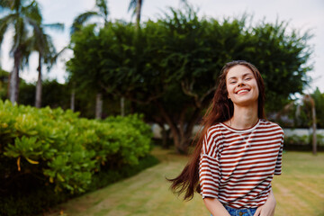 Naklejka premium woman smiling summer t-shirt beautiful girl walk nature park lifestyle freedom