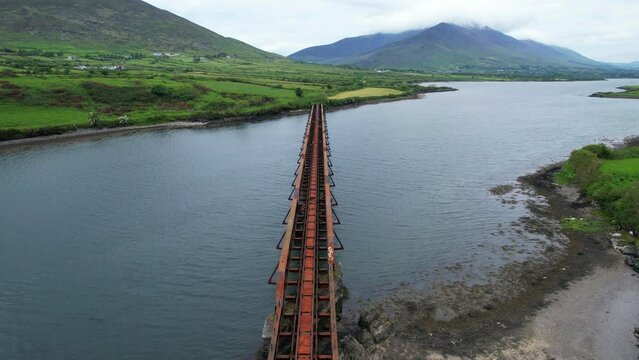 Valentia River Viaduct railway tracks and beautiful Irish landscape in background, aerial