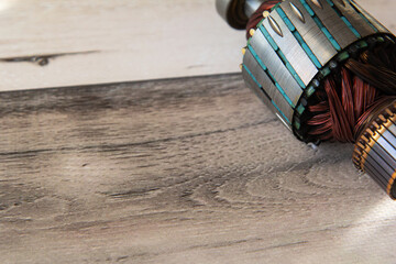 Close up view of electric motor rotor wooden background. Copy space