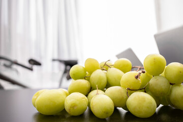 detail of green grapes on dark background, grape concept