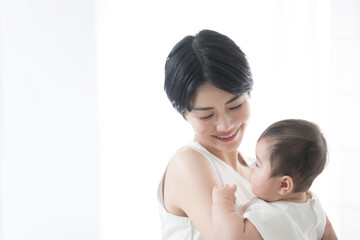 Wonderful mother carrying her baby