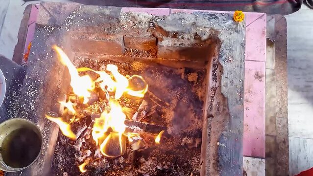 hindu holy rituals with fire from top angle at day video is taken mahavir temple patna bihar india on Apr 15 2022.