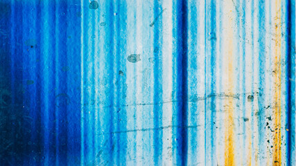 Fototapeta na wymiar Grunge texture. Colorful surface. Dirty background. Blue yellow striped distressed screen with scratches muddy spots overlay free space.