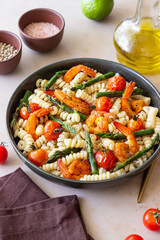 Pasta with shrimp, asparagus and tomatoes. Healthy eating. Diet.