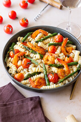Pasta with shrimp, asparagus and tomatoes. Healthy eating. Diet.