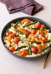 Pasta with shrimp, asparagus and tomatoes. Healthy eating. Diet.