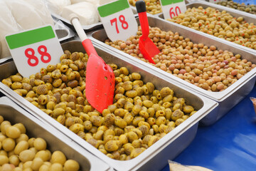 Buckets of olives for sale street food market