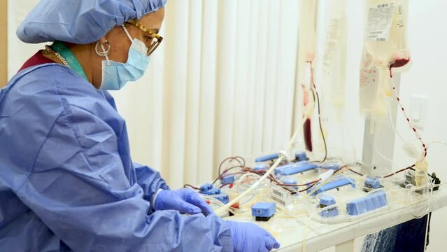 Nurse installing Hemodialysis Machine in the hospital