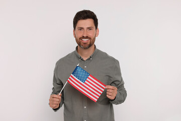 4th of July - Independence Day of USA. Happy man with American flag on white background