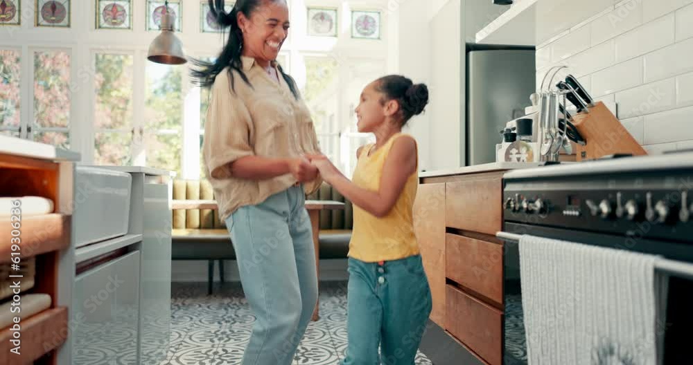 Wall mural Jumping, happy and mom dancing with her kid for bonding, having fun and spending time together. Happiness, goofy and young mother singing and doing a dance to music with her girl child at family home