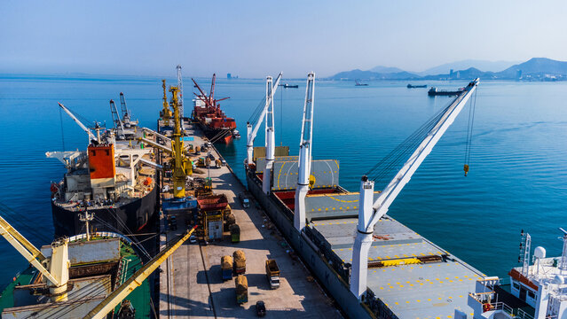 Large container port with cargo ships and gantry cranes