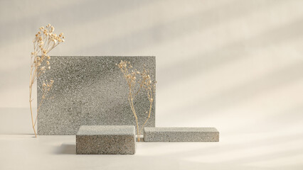 Minimal stone stage product display with sunlight from window and dry flower on cream color...
