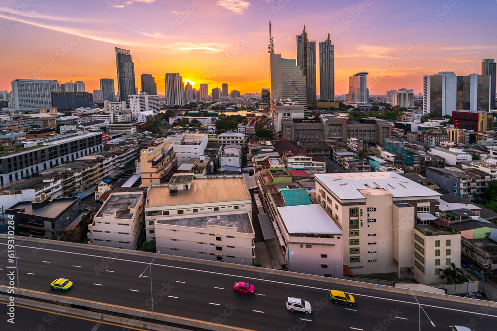 Wall mural cityscape of Bangkok city skyline with sunset sky background, Bangkok city is modern metropolis of Thailand and favorite of tourists