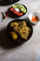 Mughlai food biryani in a bowl. Top view, selective focus.