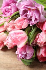 Fototapeta na wymiar Beautiful bouquet of colorful tulip flowers on table, closeup