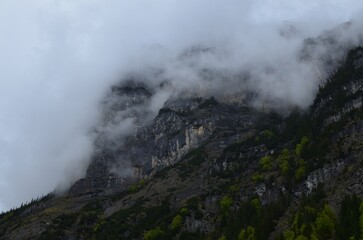 Picturesque view of mountains covered with fog