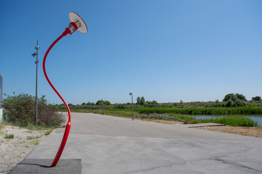 Sculpture park at Arken museum at Ishoj, denmark, in the evening sun - a museum for contemporary art near Copenhagen