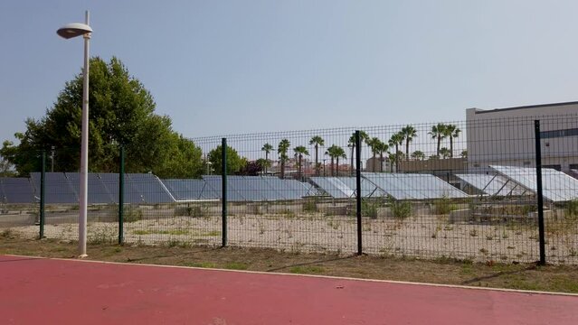 The entire field with solar panels that heat the water of an Olympic swimming pool.