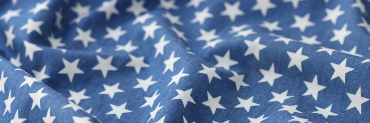 Blue wavy fabric with white stars texture background