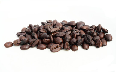 Pile of Dark brown roasted coffee beans isolated on white background, Raw processed food for drinks refreshment