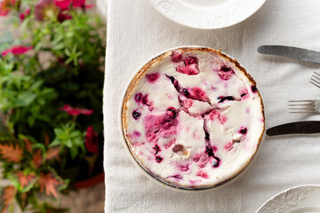 Top view of delicious cottage cheese casserole with berries. Fresh pastries, healthy curd desserts