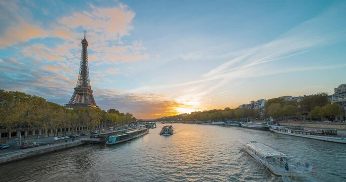 Breathtaking beauty of Paris during sunset in timelapse. The iconic famous Eiffel Tower and Seine River in France best travel landmark in Europe. Experience charm and romance of cultural destination.