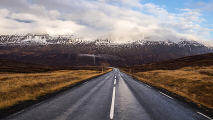 Enchanting Icelandic Landscape: Snow-Covered Mountains and Scenic Road
