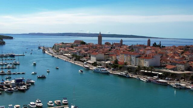 Rab - Croatia - An aerial view with the drone over the beautiful town of Rab - The drone rises above the town of Rab and the marina and opens up a fantastic view of the Croatian islands