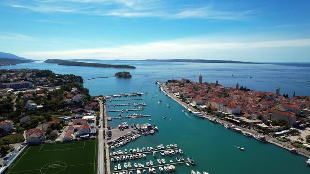 Rab - Croatia - An aerial view with the drone over the beautiful town of Rab - The drone rises above the town of Rab and the marina and opens up a fantastic view of the Croatian islands