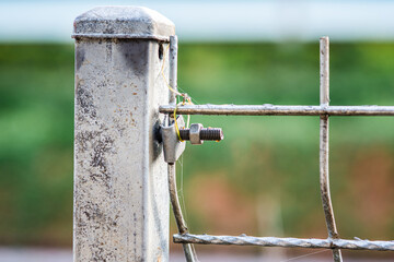 Nut and bolt connected mesh fence with column, Mesh fence of railway, selective focus.