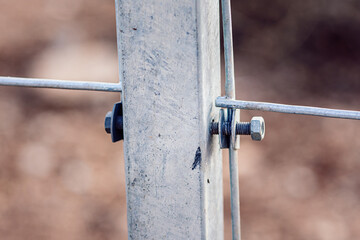 Nut and bolt connected mesh fence with column, Mesh fence of railway, selective focus.