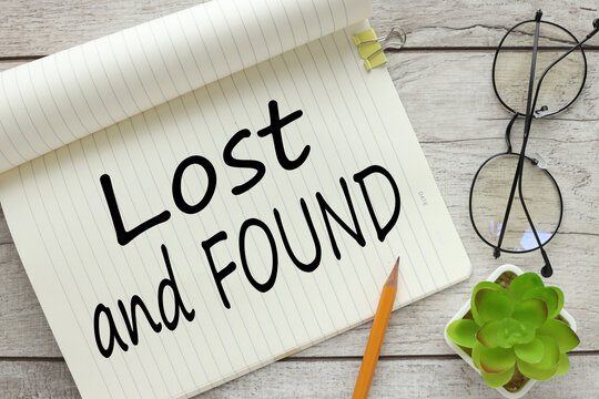 lost and found words on a piece of paper, on the work table near the glasses