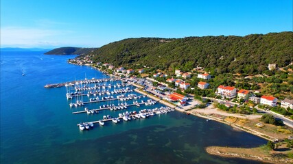Supetarska Draga - Island Rab - Croatia - marina - The drone rises above the bay and opens up an...