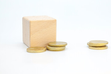 wooden cubes with coins on a white background.
ideas for concepts for inflation, economy