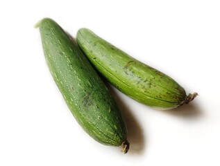 Sponge gourd is a vegetable native to South and Southeast Asia. It is also known as Egyptian cucumber or Vietnamese luffa. Scientific name - Luffa aegyptiaca.  - obrazy, fototapety, plakaty