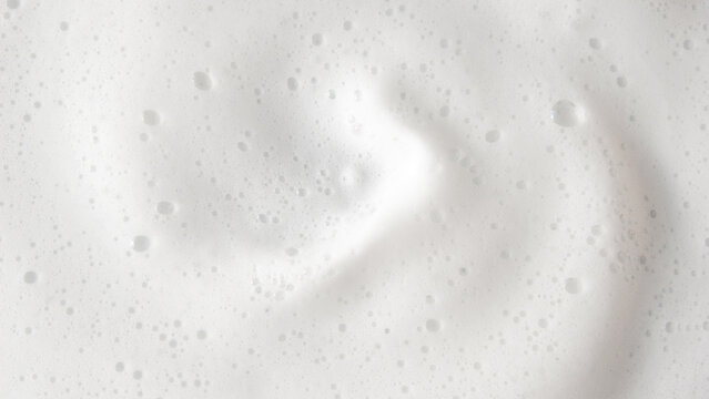 Abstract background white soapy foam texture. Shampoo foam with bubbles