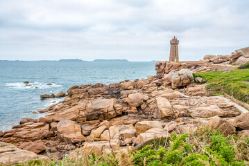 View at the Lighthouse of Red rocks(Phare de Men Ruz)at Atlantic seafront in Brittany, France